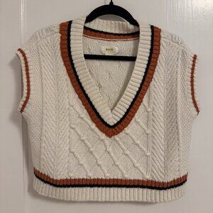 White, orange & black sweater vest by Anthropologie.